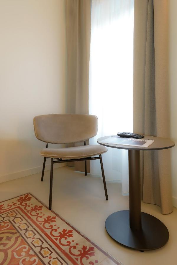 Bergamo Inn 21 Extérieur photo A chair